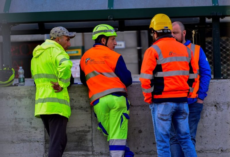 Officials stand near the site of a train accident in which workers were killed, in Brandizzo, Italy, August 31, 2023. REUTERS/Massimo Pinca