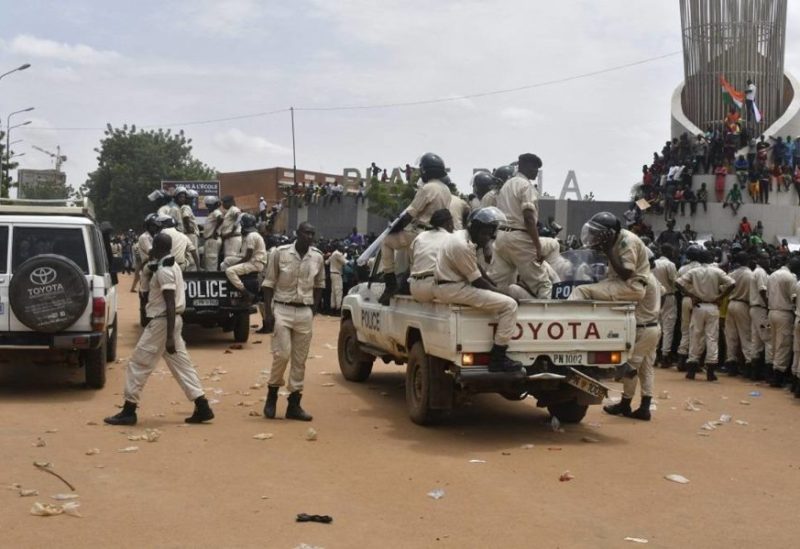 Nigerien policemen are seen as supporters rally in support of Niger's junta in Niamey on July 30, 2023. (AFP)
