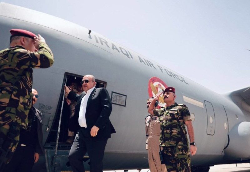 Iraqi Defense Minister Thabet Mohammed al-Abbasi boards military cargo plane during domestic flight in June (Iraqi Ministry of Defense)