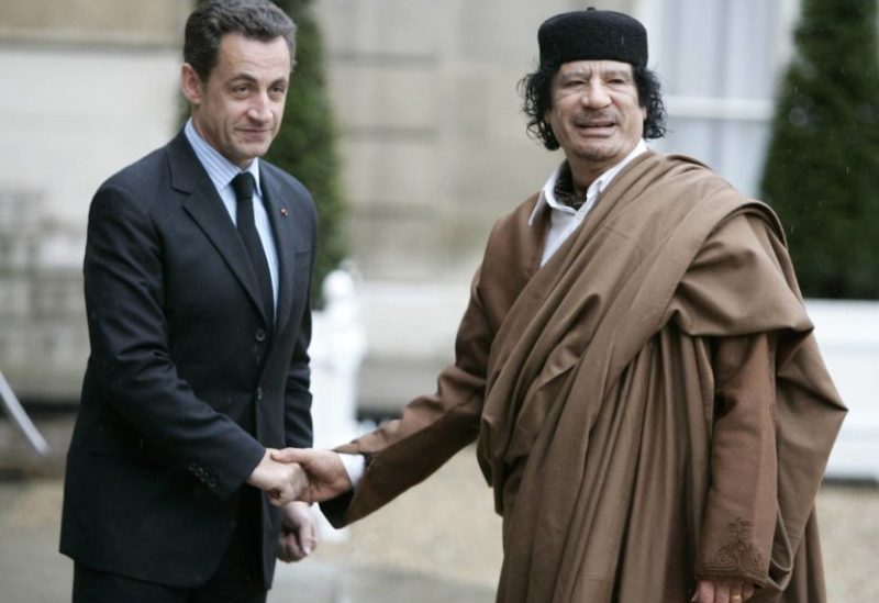 FILE - French President Nicolas Sarkozy, left, greets Libyan leader Col. Moammar Gadhafi upon his arrival at the Elysee Palace, in Paris Dec. 10, 2007. (AP Photo/Francois Mori, File)