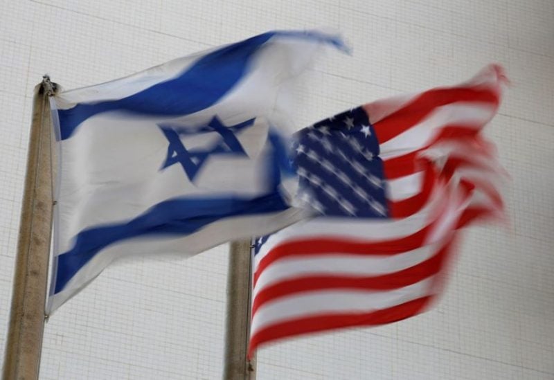 The American and the Israeli national flags can be seen outside the U.S Embassy in Tel Aviv, Israel December 5, 2017. REUTERS
