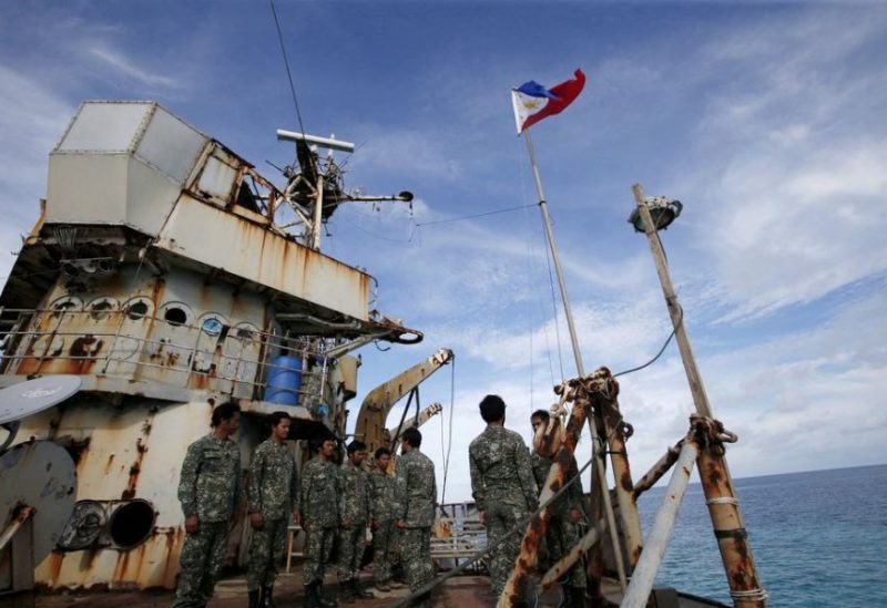 Members of Philippine Marines is pictured at BRP Sierra Madre, a dilapidated Philippine Navy ship that has been aground since 1999 and became a Philippine military detachment on the disputed Second Thomas Shoal, part of the Spratly Islands, in the South China Sea March 29, 2014. REUTERS