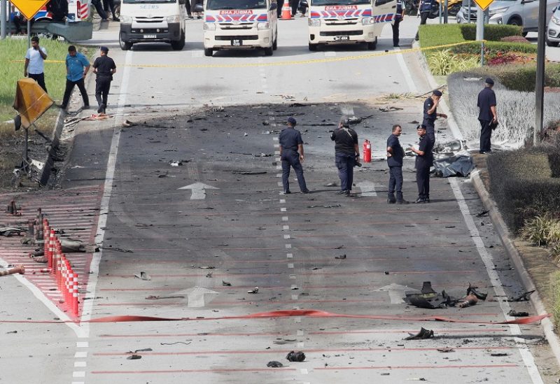 Authorities inspect the scene of a plane crash in Shah Alam, Malaysia August 17, 2023. REUTERS/Hasnoor Hussain