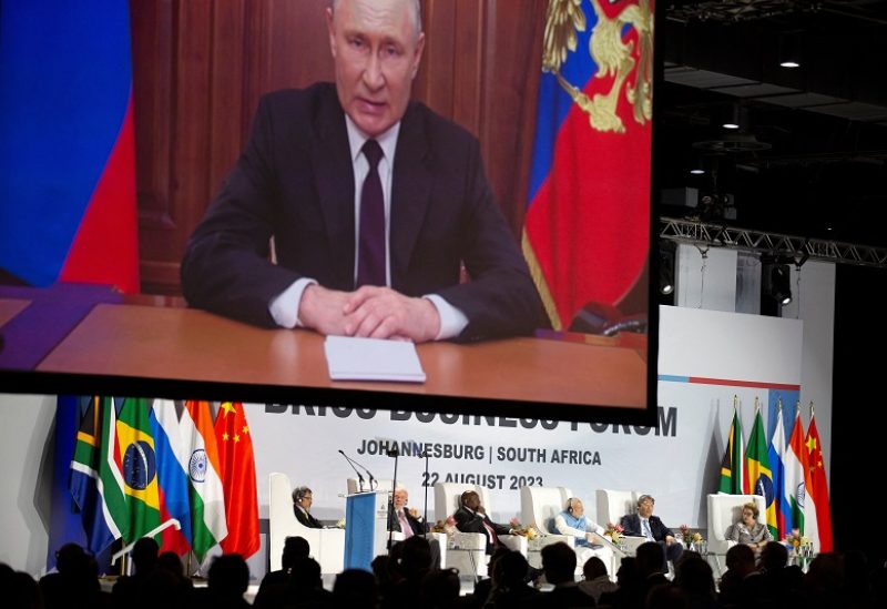 A recorded message from Russian president Vladimir Putin is aired during the opening remarks at the BRICS Summit in Johannesburg, South Africa August 22, 2023 REUTERS/James Oatway