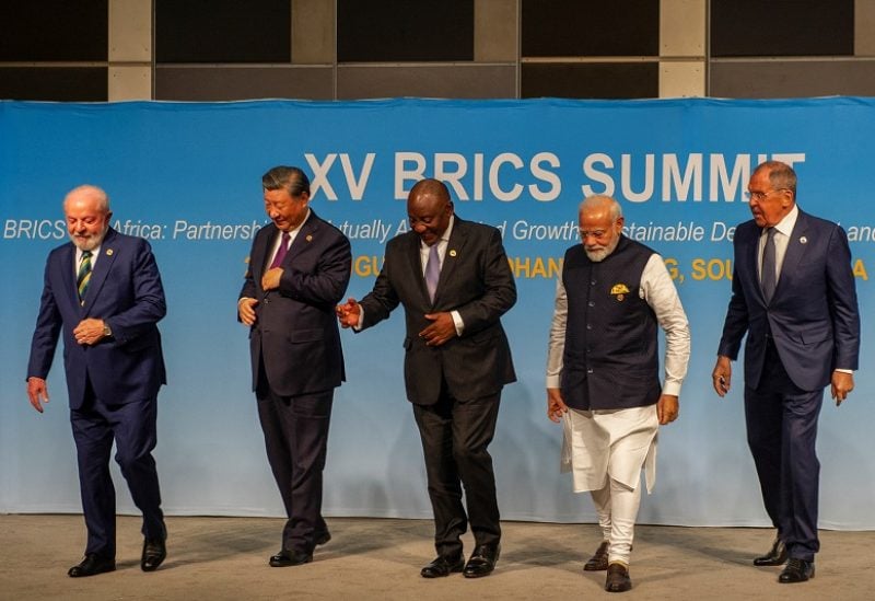Brazil's President Luiz Inacio Lula da Silva, China's President Xi Jinping, South African President Cyril Ramaphosa, Indian Prime Minister Narendra Modi and Russia's Foreign Minister Sergei Lavrov walk after posing for a picture at the BRICS Summit in Johannesburg, South Africa August 23, 2023. REUTERS/Alet Pretorius/Pool
