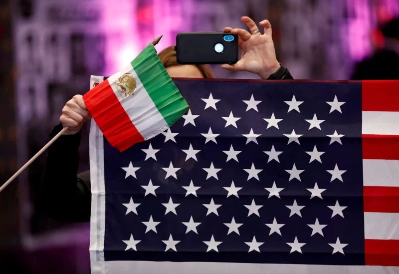 Attendees hold flags from Iran and the United States as Iranian Americans from across California converge in Los Angeles, California, U.S., January 11, 2020. REUTERS/