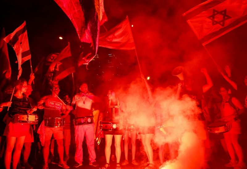 People take part in a demonstration against Israeli Prime Minister Benjamin Netanyahu and his nationalist coalition government's judicial overhaul, in Tel Aviv, Israel July 29, 2023. REUTERS/Ammar Awad