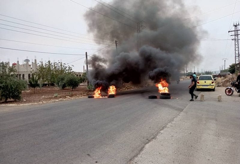 Tires burn as demonstrators protest against the Syrian government decision on increasing the prices of fuels in Sweida, Syria, August 17,2023. Sweida 24/Handout via REUTERS THIS IMAGE HAS BEEN SUPPLIED BY A THIRD PARTY. NO RESALES. NO ARCHIVES. MANDATORY CREDIT