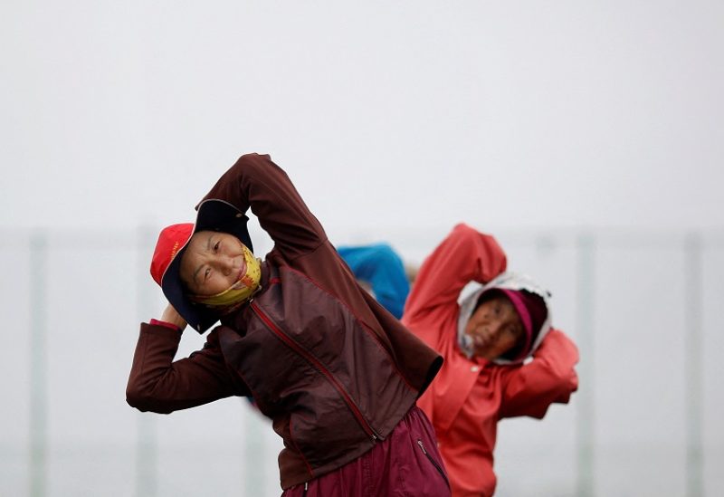 FILE PHOTO: Elderly residents exercise on the island of Yeonpyeong, which lies on the South Korean side of the Northern Limit Line (NLL), in the Yellow Sea April 9, 2014. REUTERS/Damir Sagolj (SOUTH KOREA - Tags: MILITARY SOCIETY POLITICS)/File Photo