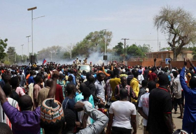 Nigerien security forces launch tear gas to disperse pro-junta demonstrators gathered outside the French embassy, in Niamey, the capital city of Niger July 30, 2023. REUTERS