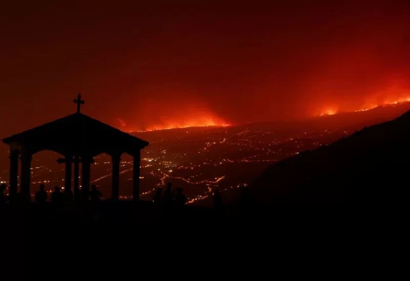 A view shows a fire over the mountains near empty houses after the evacuation in different villages in the north, as wildfires rage out of control on the island of Tenerife, Canary Islands, Spain August 20, 2023. REUTERS