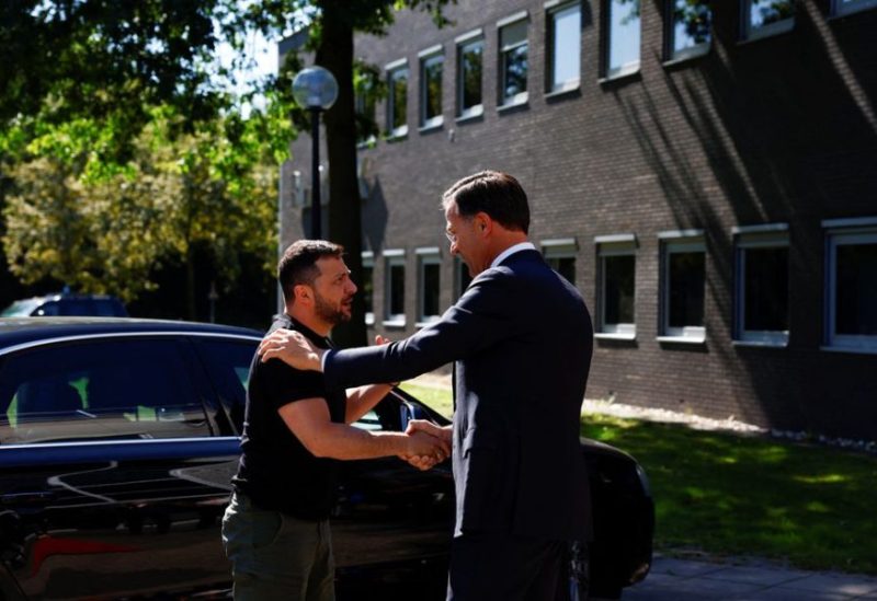 Ukrainian President Volodymyr Zelenskiy is greeted by Dutch Prime Minister Mark Rutte, during his visit to Eindhoven, Netherlands, August 20, 2023. REUTERS