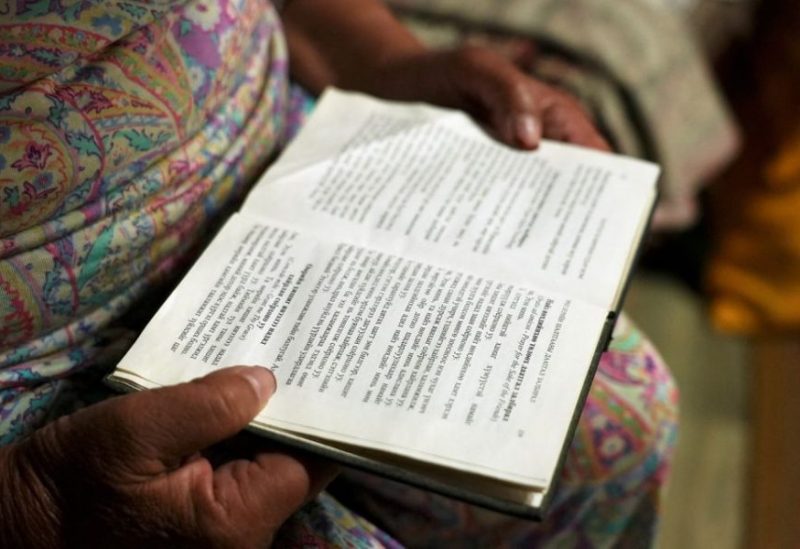 Catholic devotee Perlimaa Gavaadandov, 71, reads from a Mongolian-language bible while reciting a Christian prayer before bed, in a yurt on the outskirts of Arvaikheer city, Mongolia August 28, 2023. REUTERS