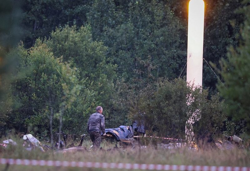 Emergency specialists work near wreckages of the private jet linked to Wagner mercenary chief Yevgeny Prigozhin is seen near the crash site in the Tver region, Russia, August 24, 2023. REUTERS/Marina Lystseva