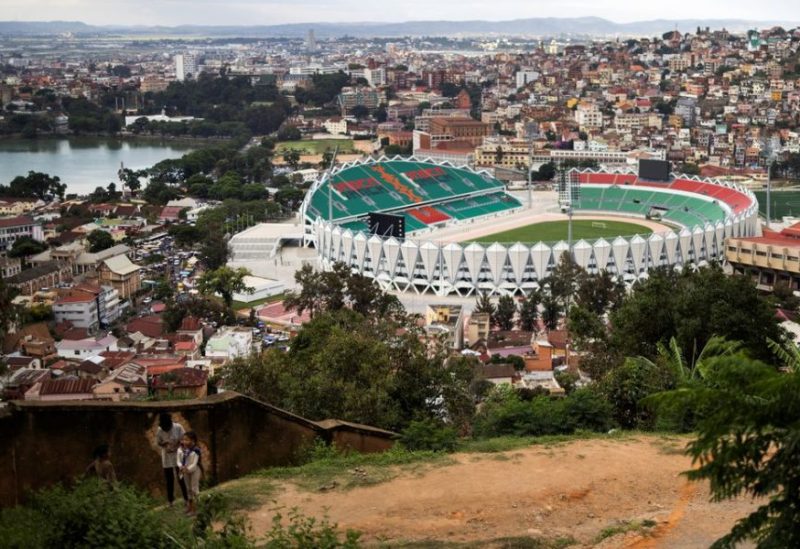 Children stand on a hill as the Mahamasina Municipal Stadium is seen in the background in Antananarivo, Madagascar, February 3, 2022. REUTERS