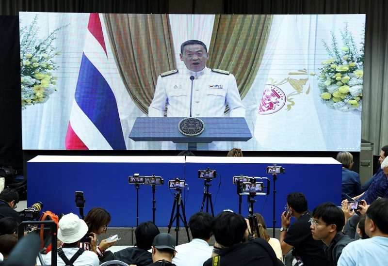Pheu Thai's Srettha Thavisin is seen on a screen as he speaks during a live nationwide broadcast at the party headquarters following a royal endorsement ceremony after Thailand's parliament voted in favour of his prime ministerial candidacy, in Bangkok, Thailand August 23, 2023. REUTERS/Athit Perawongmetha