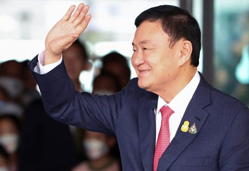 Former Thai Prime Minister Thaksin Shinawatra, who is expected to be arrested upon his return as he ends almost two decades of self-imposed exile, waves at Don Mueang airport in Bangkok, Thailand August 22, 2023. REUTERS/Athit Perawongmetha/File Photo