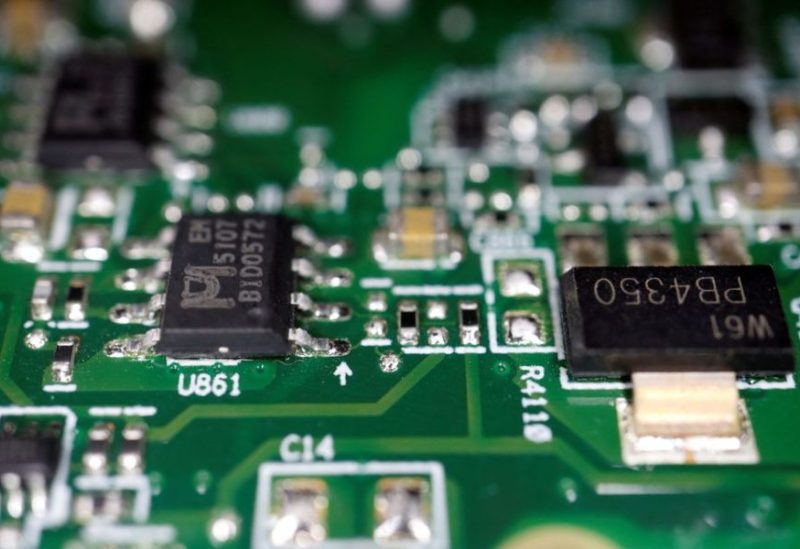 Semiconductor chips are seen on a printed circuit board in this illustration picture taken February 17, 2023. REUTERS