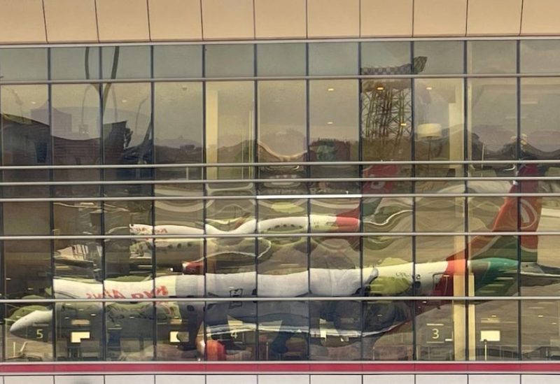 A reflection from the windows show Kenya Airways planes parked at terminal within the Jomo Kenyatta International Airport near Nairobi, Kenya March 7, 2023. REUTERS