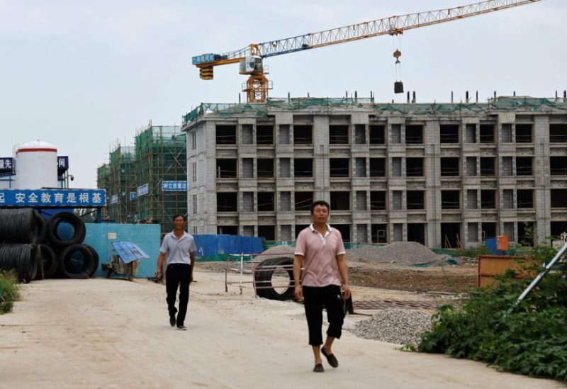 Workers walk out of a construction site of residential buildings by Chinese developer Country Garden, in Tianjin, China August 18, 2023. REUTERS
