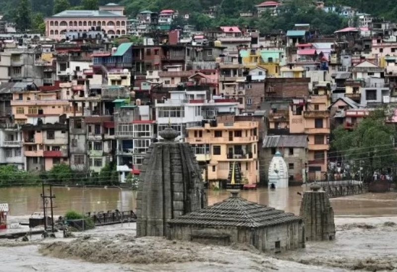 A temple is submerged in floodwaters after the river Beas overflowed in Mandi