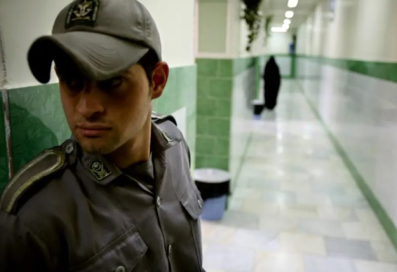 A prison guard stands along a corridor in Tehran's Evin prison June 13, 2006.