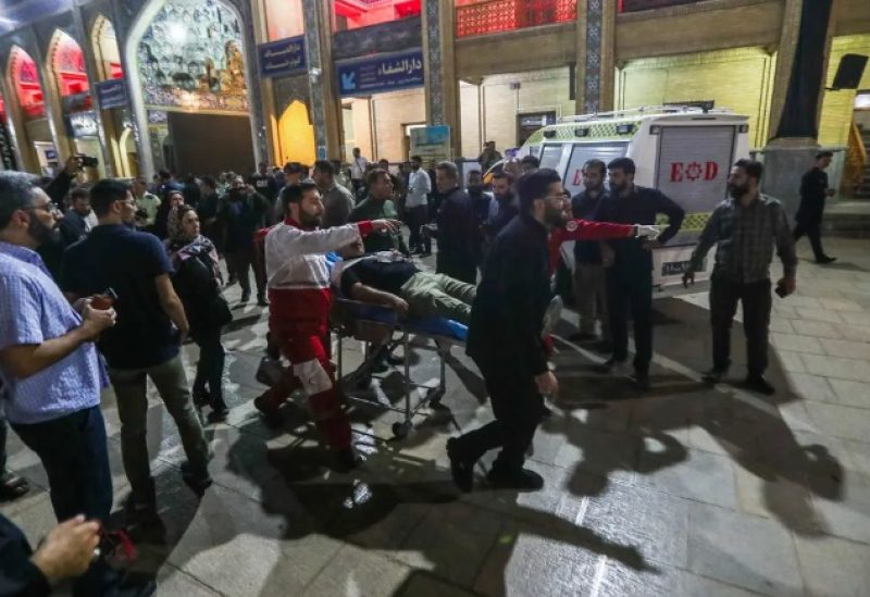 Emergency personnel transport the injured following a shooting attack at Iran's Shah Cheragh mausoleum in the Fars province capital Shiraz, on August 13, 2023. (AFP)