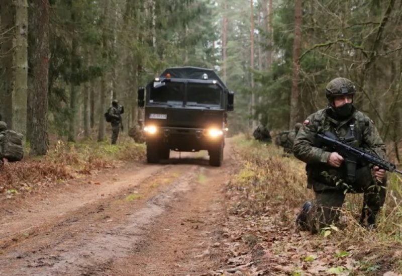 Polish soldiers patrol Poland-Belarus border in undisclosed location in Poland, in this photograph released by the Territorial Defense Forces. (File photo: Reuters)