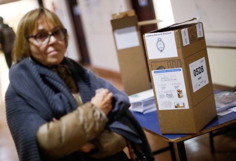 A woman waits to cast her vote during Argentina's primary elections, in a polling station in Buenos Aires, Argentina August 13, 2023. REUTERS/Agustin Marcarian
