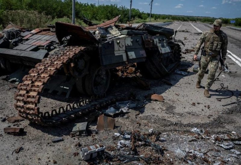 A Ukrainian serviceman walks near a destroyed Ukrainian tank, as Russia's attack on Ukraine continues, near the village of Robotyne, Zaporizhzhia region, Ukraine August 25, 2023. (Reuters)