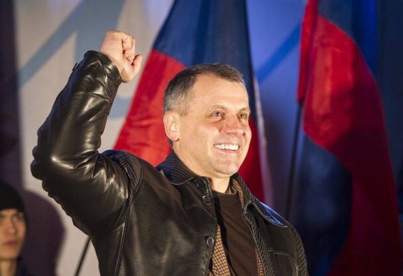 Crimea's parliamentary speaker Vladimir Konstantinov celebrates switching to Moscow time in the Crimean city of Simferopol March 30, 2014. REUTERS/Shamil Zhumatov/file photo