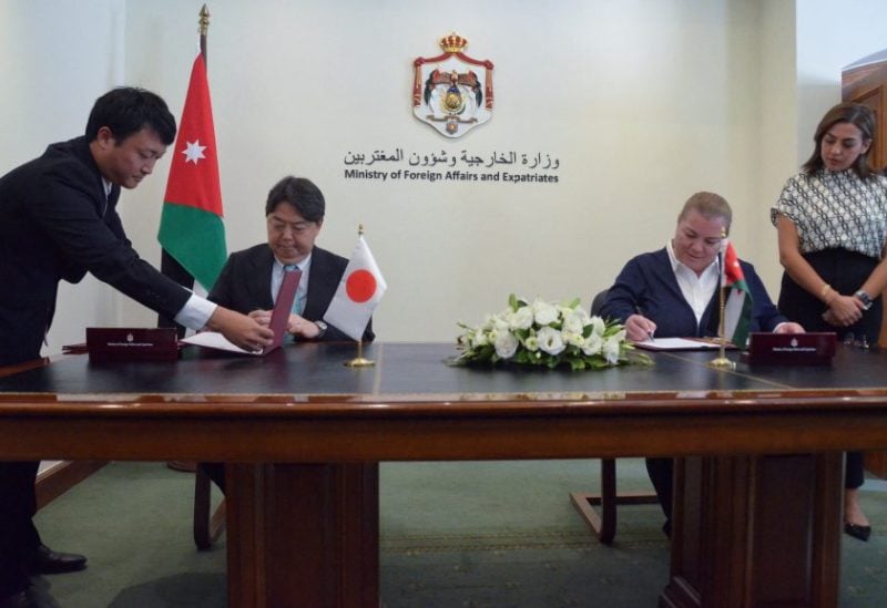 Japanese Foreign Minister Yoshimasa Hayashi and Jordan's Minister of Planning and International Cooperation Zeina Toukan sign agreements in Amman, Jordan September 3, 2023. REUTERS/Muath Freij