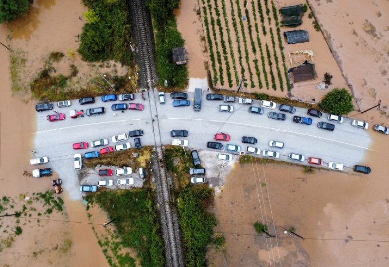 An aerial view of cars stuck on a bridge surrounded by flood waters, as storm Daniel hits central Greece, in the village of Flamouli, near Trikala, Greece, September 7, 2023. REUTERS/Stergios Spiropoulos