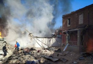 A local man tries to extinguish burning buildings at a site of a Russian missile strike, amid Russia's attack on Ukraine, in Kryvyi Rih, Dnipropetrovsk region, Ukraine September 8, 2023. Press service of the State Emergency Service of Ukraine/Handout via REUTERS