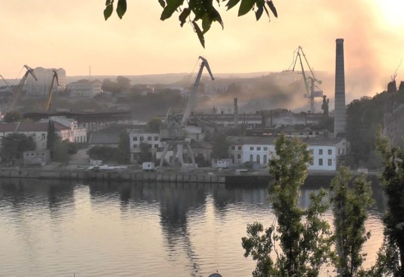Smoke rises from the shipyard that was reportedly hit by Ukrainian missile attack in Sevastopol, Crimea, in this still image from video taken September 13, 2023. REUTERS TV via REUTERS