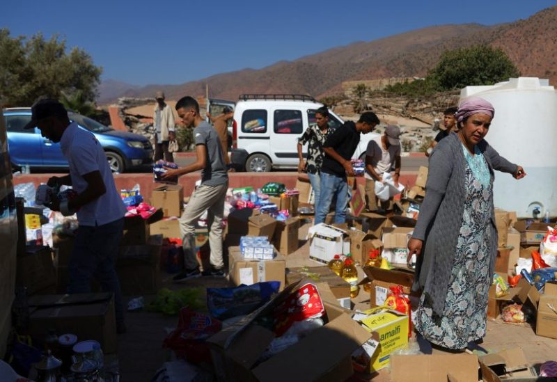 People sort aid in the aftermath of a deadly earthquake in Talat N'Yaaqoub, Morocco September 13. REUTERS/Hannah McKay