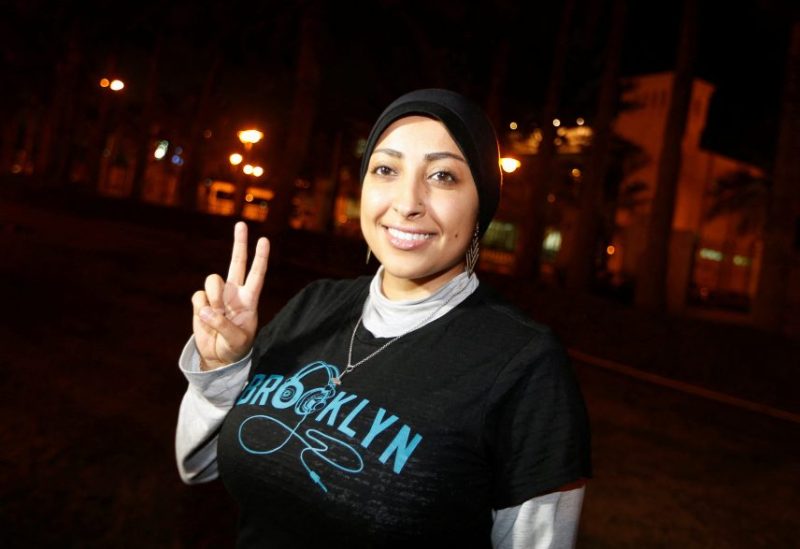Human rights activist Maryam al-Khawaja flashes a "V" sign after being released outside the Airport Police Station, in Muharraq, north of Manama September 18, 2014. REUTERS/Hamad I Mohammed