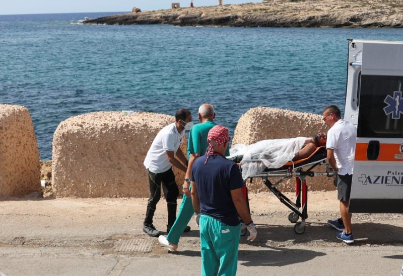 A man disembarked from Guardia di Finanza vessel is taken away on a stretcher after being rescued at sea, on the Sicilian island of Lampedusa, Italy, September 18, 2023. REUTERS/Yara Nardi