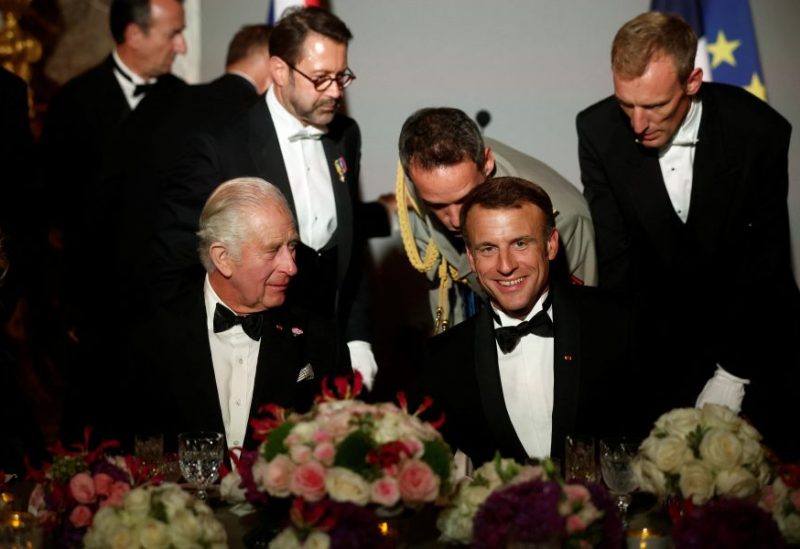 French President Emmanuel Macron and Britain's King Charles attend a state dinner in the Hall of Mirrors (Galerie des Glaces) at the Chateau de Versailles (Versailles Palace) in Versailles, near Paris, on the first day of their State visit to France, September 20, 2023. REUTERS/Benoit Tessier/Pool