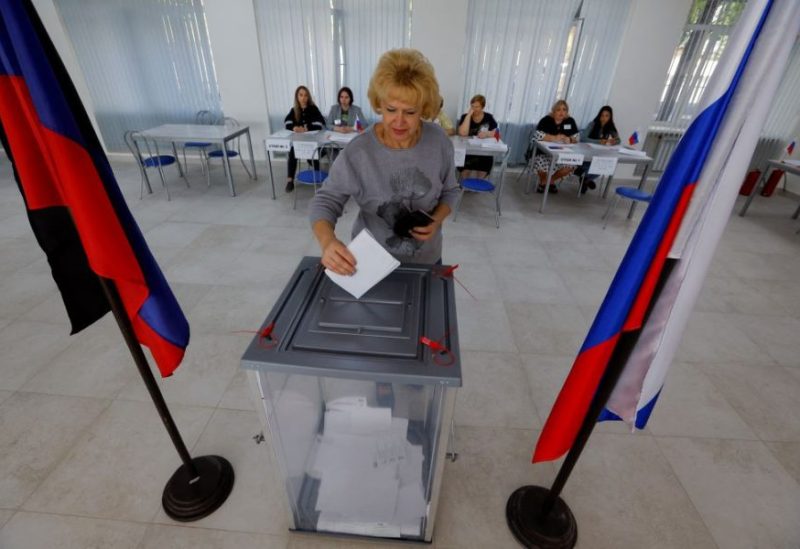 A voter casts a ballot at a polling station during local elections held by the Russian-installed authorities in the course of Russia-Ukraine conflict in Donetsk, Russian-controlled Ukraine, September 8, 2023