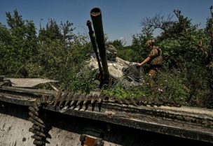 A Ukrainian serviceman inspects a turret of a destroyed Russian BMP-3 infantry fighting vehicle in the recently liberated village of Novodarivka, Ukraine July 21, 2023. REUTERS