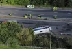 A bus carrying dozens of schoolchildren overturned on a highway near the English city of Liverpool (Photo, AP)