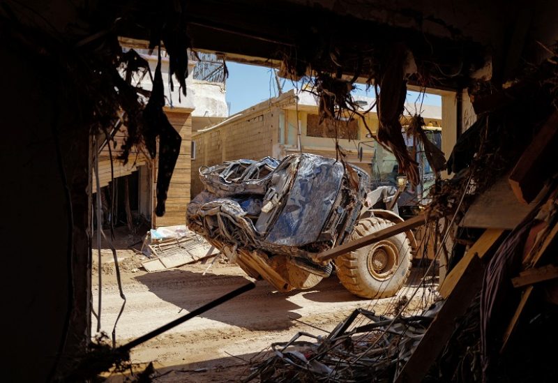 A truck carries a mangled car that was destroyed by the storm that hit Libya, in Derna, Libya September 16, 2023. REUTERS/Zohra Bensemra