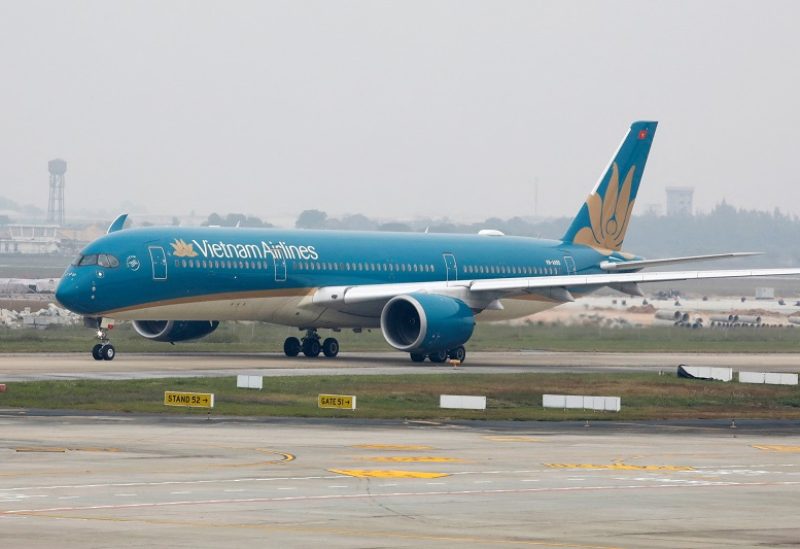 FILE PHOTO: An aircraft of the national flag carrier Vietnam Airlines taxis at Noi Bai airport in Hanoi, Vietnam December 23, 2020. Picture taken December 23, 2020. REUTERS/Kham/File Photo