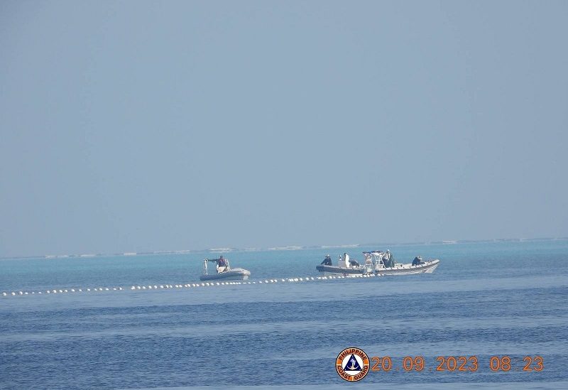 Chinese Coast Guard boats close to the floating barrier are pictured on September 20, 2023, near the Scarborough Shoal in the South China Sea, in this handout image released by the Philippine Coast Guard on September 24, 2023. Philippine Coast Guard/Handout via REUTERS THIS IMAGE HAS BEEN SUPPLIED BY A THIRD PARTY. MANDATORY CREDIT. NO RESALES. NO ARCHIVES