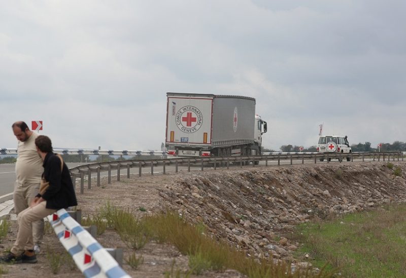 Vehicles of the International Committee of the Red Cross (ICRC) transporting humanitarian aid for residents of Nagorno-Karabakh drive towards the Armenia-Azerbaijan border along a road near the village of Kornidzor, Armenia, September 23, 2023. REUTERS/Irakli Gedenidze