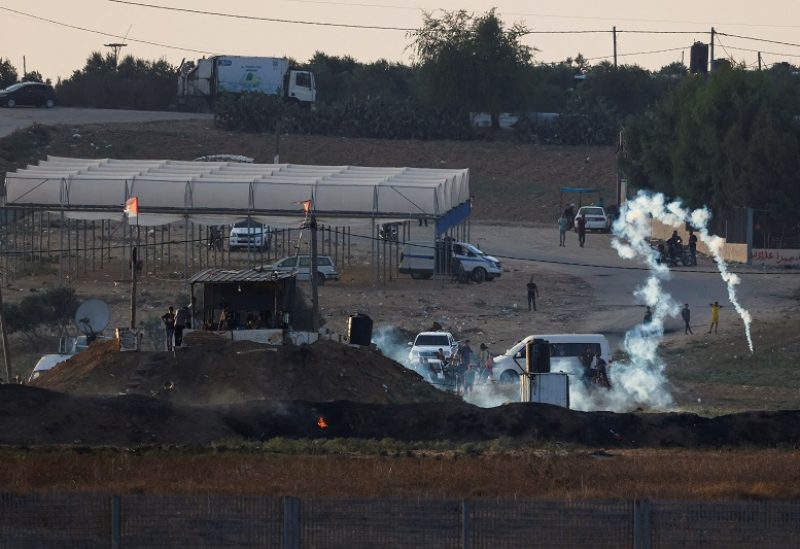Israeli soldiers and Palestinian protesters clash near the border between Israel and the Gaza Strip as seen from the Israeli side, September 23, 2023. REUTERS/Amir Cohen