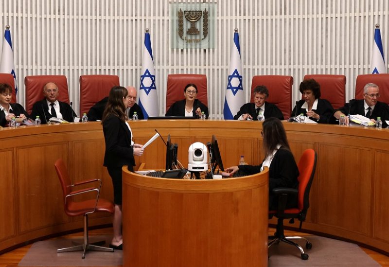 President of the Israeli Supreme Court Esther Hayut (C) and judges assemble to hear petitions against the law that blocks the court from potentially ordering the prime minister to recuse himself from office, at the court premises in Jerusalem, on September 28, 2023. MENAHEM KAHANA/Pool via REUTERS