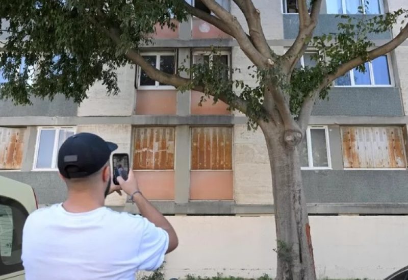 A burst of Kalashnikov gunfire hit the apartment building where the woman lived