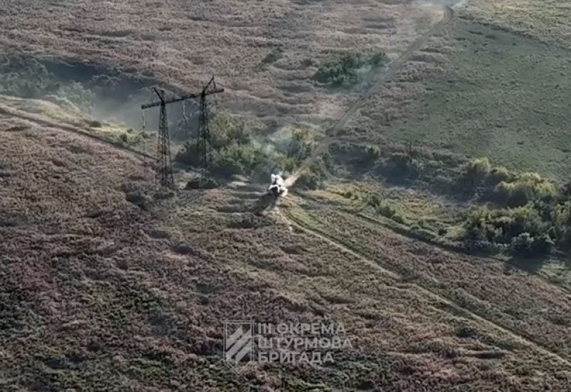 A Russian armoured vehicle is purportedly shot by a Ukrainian drone near Andriivka, Donetsk region, Ukraine in this still image obtained from video released August 22, 2023. 3rd assault brigade / Ukrainian Armed Forces Press service/via REUTERS THIS IMAGE HAS BEEN SUPPLIED BY A THIRD PARTY. MANDATORY CREDIT.